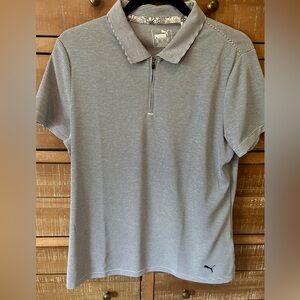 Puma brand women’s golf shirt. Blue and white stripe. Zip neck. Size XXL.